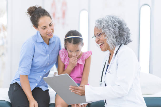 istock Elementary-age girl at the doctor's office 1096056610