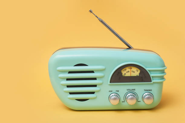 vintage fifties style radio on yellow background closeup of vintage fifties style radio on yellow background radio retro revival old old fashioned stock pictures, royalty-free photos & images