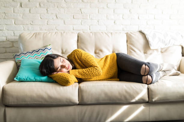 istock Tired Woman Sleeping On Sofa 1096063118