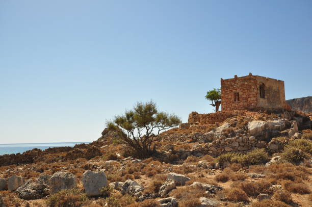 istock Stone hut in a rugged greek landscape 1096073766