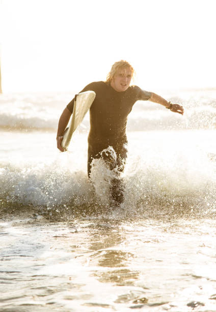 istock surfer man on huntington beach california 1096080836