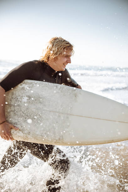 istock surfer man on huntington beach california 1096081064
