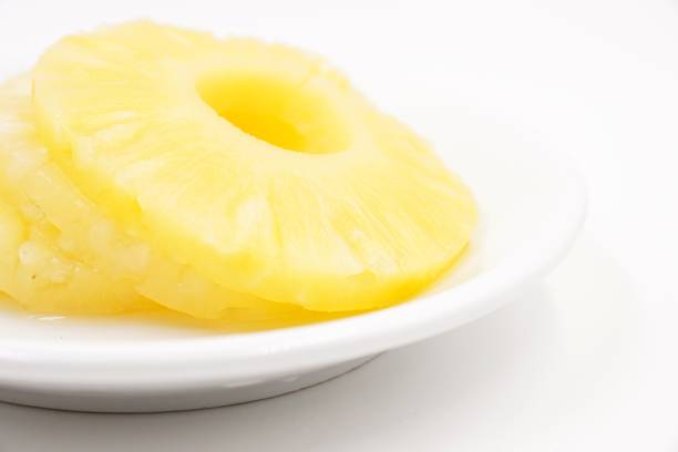 istock Pineapple slices in sweet syrup 1096082124