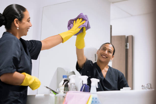 istock woman cleaning the bathroom 1096085418