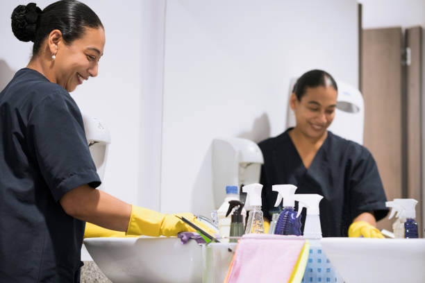 istock woman cleaning the bathroom 1096085458