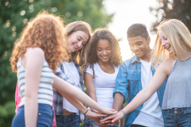 istock Friends Putting Hands Together 1096087820