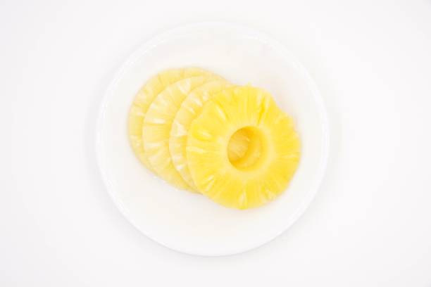 istock Pineapple slices in sweet syrup 1096091250