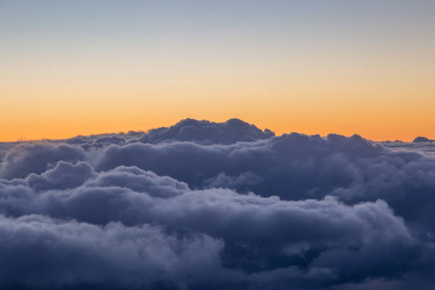 istock Storm Clouds at Sunset, Viewed from an Airplane Window 1096095464