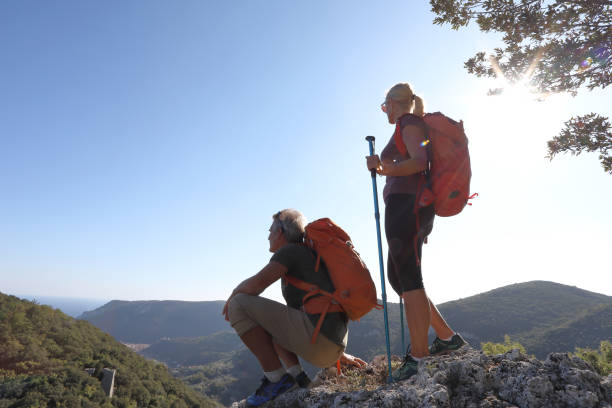 istock Couple hiking in mountains pause on summit 1096096926