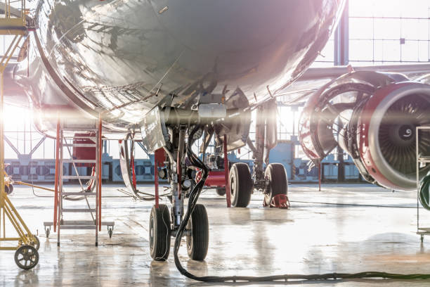 istock Landing gear and aircraft wheels in hangar, with basic power supply. 1096100518