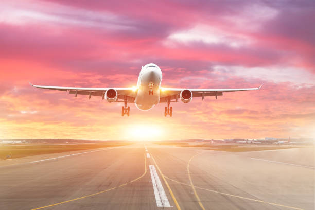 istock Passenger airplane landing at sunset on a runway 1096100532
