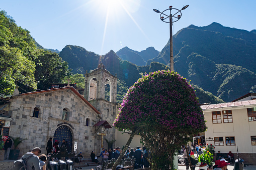 Aguas Calientes, Peru - October 17, 2018: Tourists are visiting the street scenery in the evening. Aguas Calientes is the closest town to the ancient Inca city Machu Picchu, it has become a tourist hub for visitors wishing to see the famous landmark.