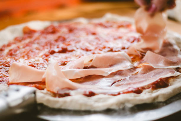 istock Woman making original italian pizza at home. 1096116334