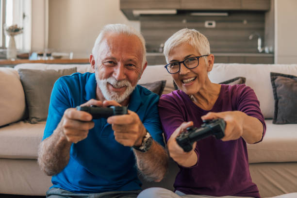 istock Senior couple playing video games 1096116910