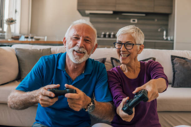 istock Mature couple playing video games 1096116950