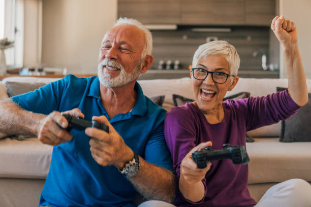 istock Husband and wife playing video games 1096117110