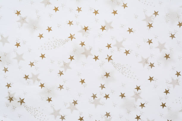 istock Abstract background with golden stars close-up on a white background 1096117546