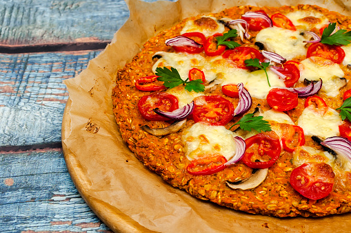 Pizza with blat of sweet potato and oat seeds