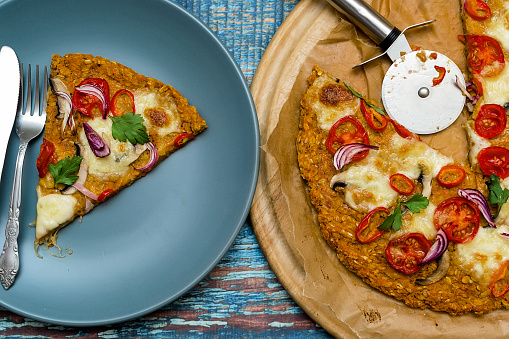 Pizza with blat of sweet potato and oat seeds