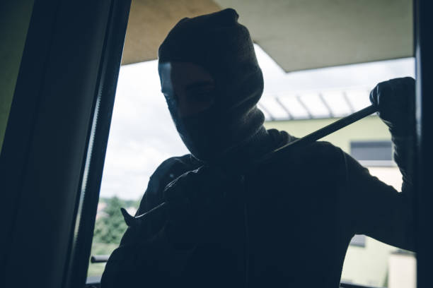 istock Burglar Breaking Into House 1096121082