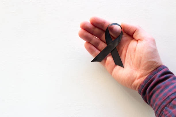 istock man hold black ribbon with place for text on white background 1096123654