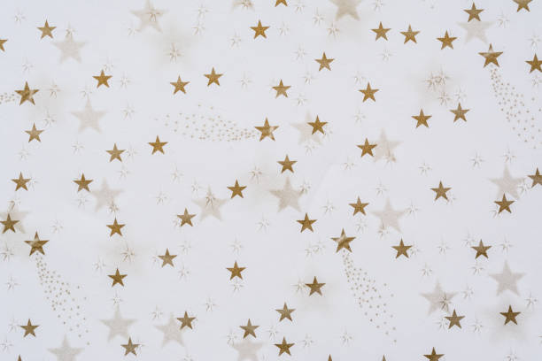 istock Abstract background with golden stars close-up on a white background 1096126736