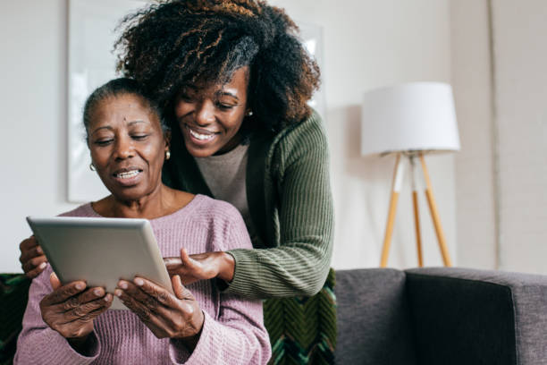 istock Showing new app to senior women 1096128156