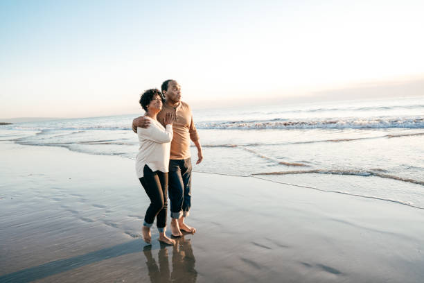 istock Senior couple enjoying sunset on the beach 1096128180