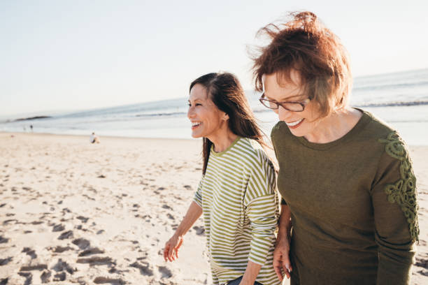 istock Gossiping with friends on the beach 1096128284