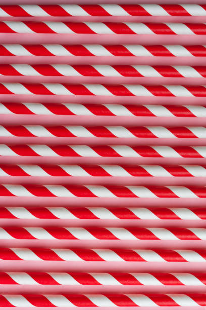 istock Red and White striped straws. Pink background 1096131096