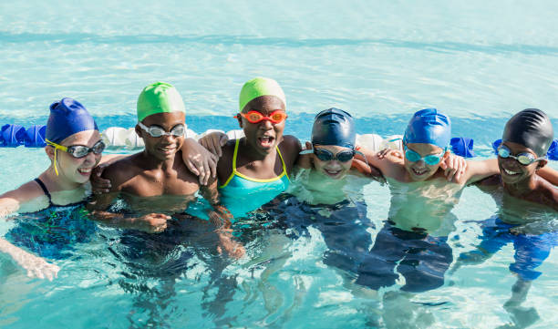 istock Multi-ethnic children on swim team in pool 1096131332