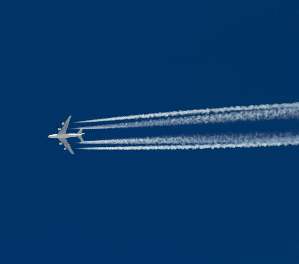 istock Big passenger airplane flies leaving a trail in the cloudless sky. 1096146870