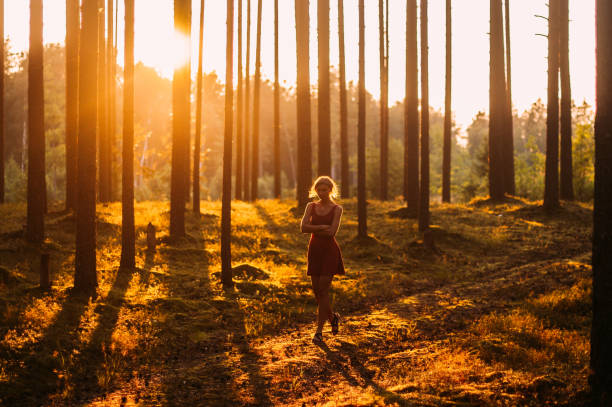 istock Young angry girl in evening forest 1096149348