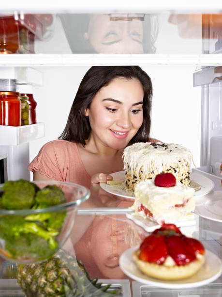 istock Woman and fridge 1096150834