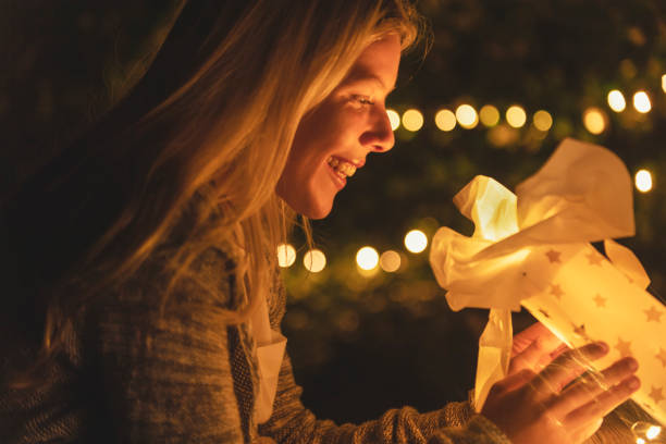 istock Woman opening a shopping bag with a gift inside. 1096175424