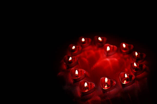 istock Valentine's Day, Heart shaped candles on red background 1096183674