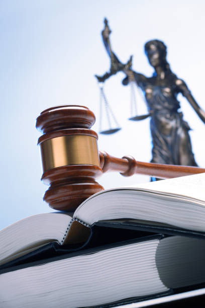 istock Gavel On Open Law Book With Lady Justice In The Background 1096194800