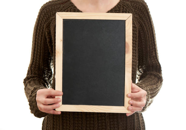 istock Woman Holding Blank Blackboard 1096202856
