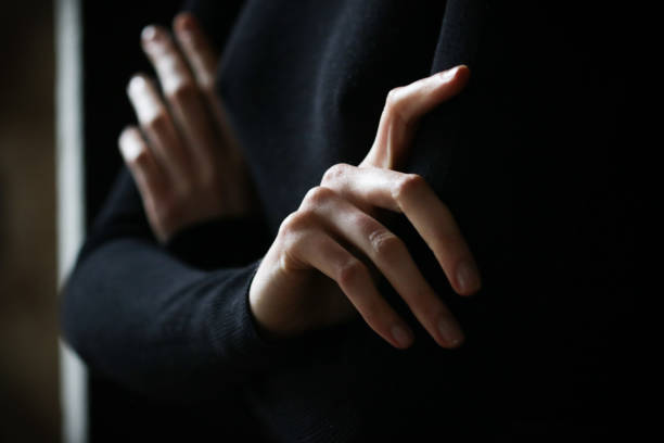istock a woman with her arms crossed is going to make a decision and thinks about an important act in a pose with her arms crossed in black in anticipation 1096216680
