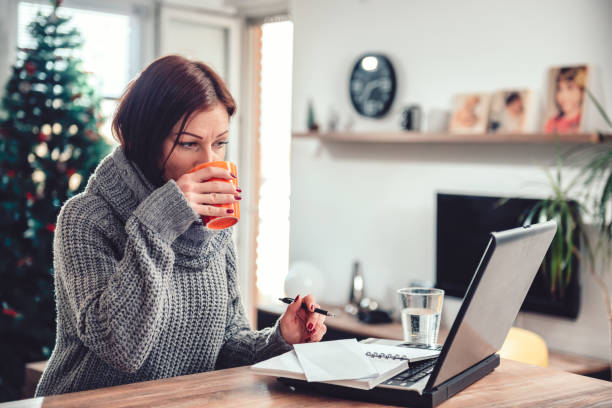 istock Woman working in home office and drinking coffee 1096218072
