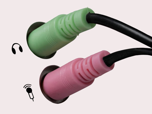 istock 0632 Plug for headphones, headsets and microphone on a computer, white background, left side 1096218850