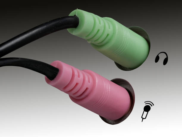 0635 Plug for headphones, headsets and microphone on a computer, gray, white background, right side