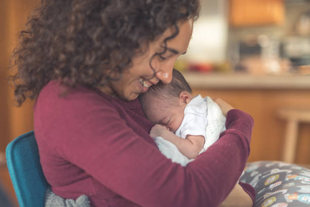 istock New mom holds her infant daughter 1096219360