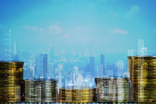 istock Double exposure of coin stack with financial graph over city and office building background, business and financial concept. 1096223418