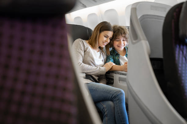 istock Happy mother and son traveling by plane 1096223676