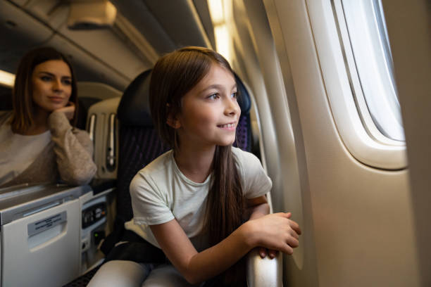 istock Happy girl traveling by plane 1096223764