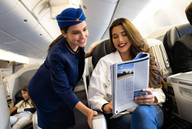 istock Flight attendant helping a woman in the airplane 1096223800