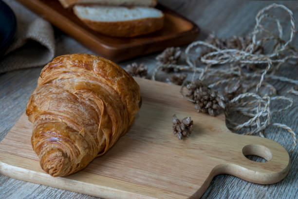 istock Fresh croissants on a wooden chopping board 1096223954