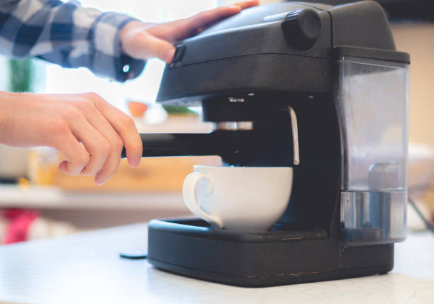 istock person use coffee machine to make fresh espresso  f 1096225158