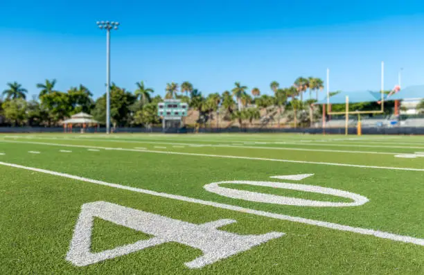 Football stadium 40 yard line artificial grass and markings.
